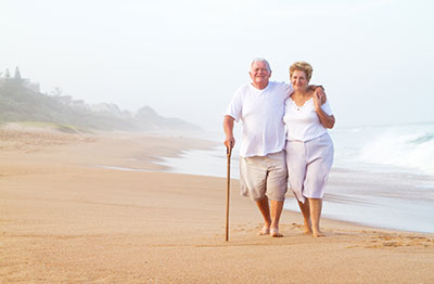 Elderly couples walking on a beach