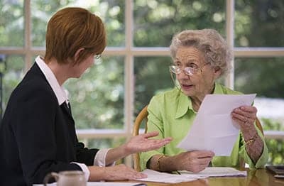Female advisor advising elderly women